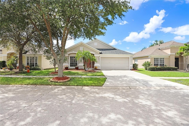 view of front facade with a garage and a front yard