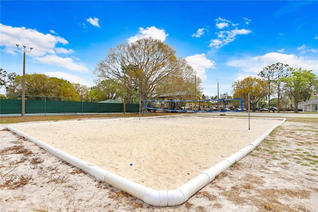 view of home's community featuring volleyball court