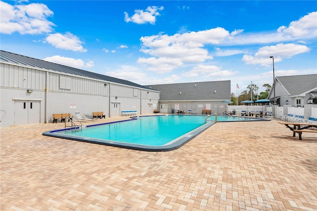 view of swimming pool featuring a patio area