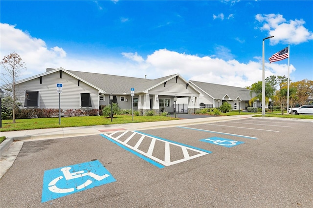 view of car parking featuring a yard