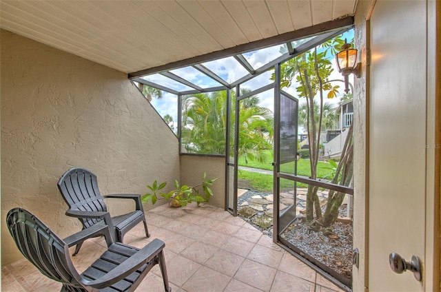 sunroom / solarium with wood ceiling and lofted ceiling