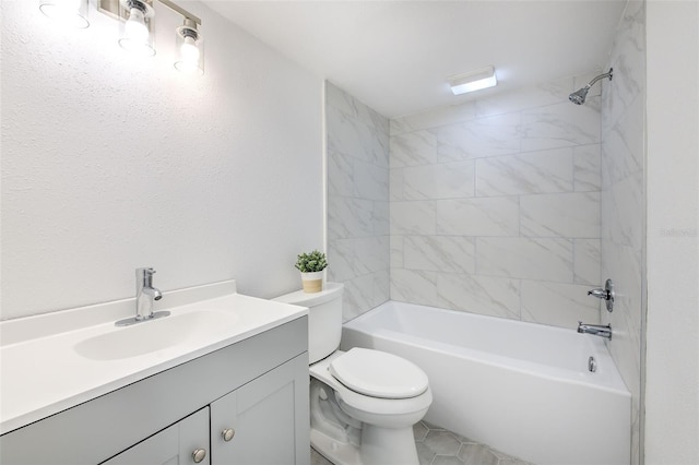 full bathroom with tiled shower / bath, toilet, and vanity