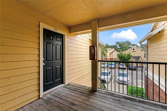 view of exterior entry featuring a balcony