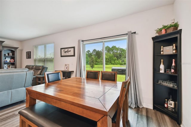 dining room with dark hardwood / wood-style floors