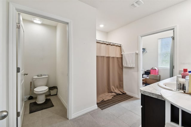 bathroom with tile patterned flooring, toilet, a shower with shower curtain, and vanity