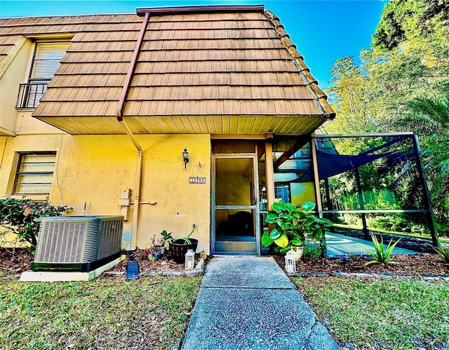 property entrance with central AC unit