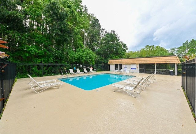 view of swimming pool featuring a patio