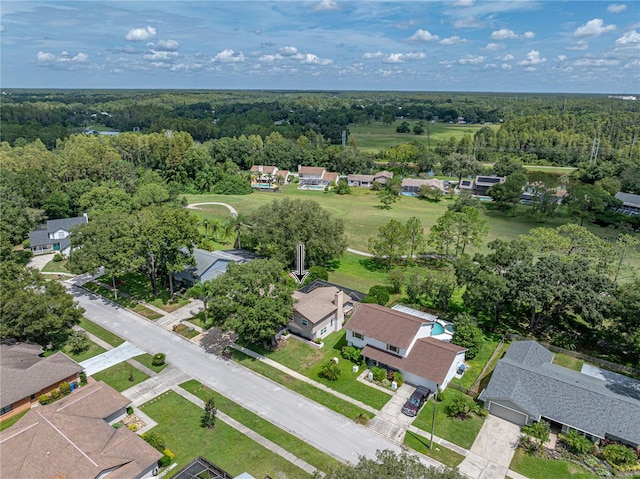 birds eye view of property with a residential view and a forest view