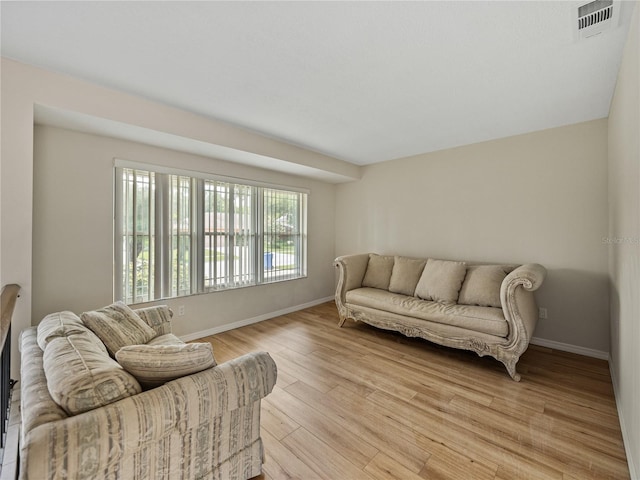 living room with light hardwood / wood-style flooring