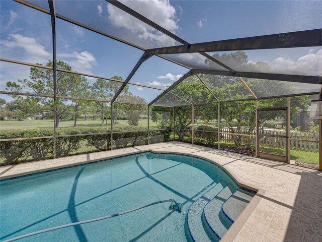 view of pool with a lanai and a patio area