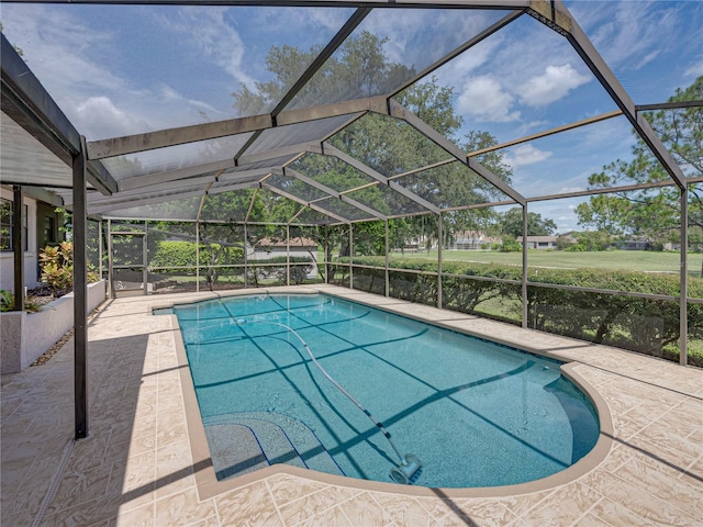 view of pool featuring a lanai and a patio