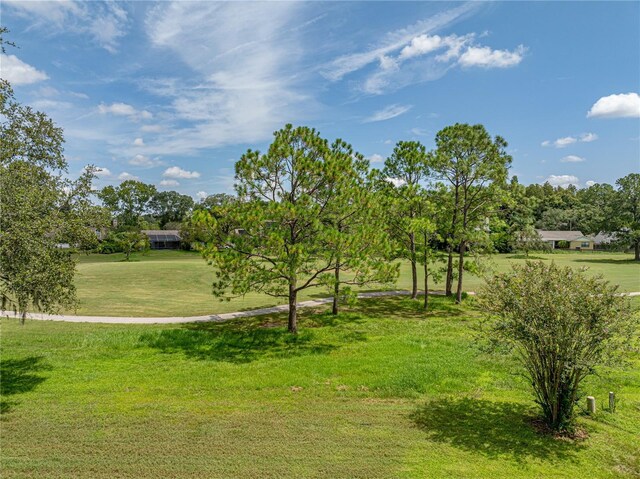 view of home's community featuring a lawn