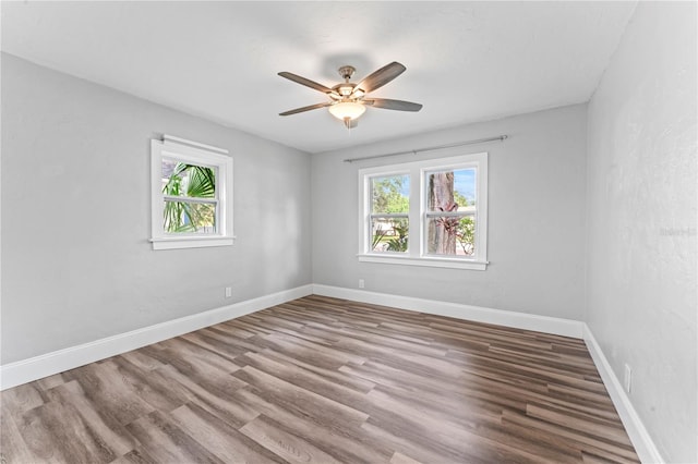 spare room featuring ceiling fan and wood-type flooring