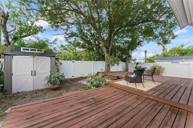 wooden deck featuring a storage shed