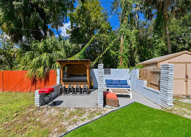 exterior space featuring a patio area and a shed