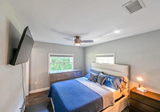 bedroom featuring ceiling fan and dark hardwood / wood-style floors