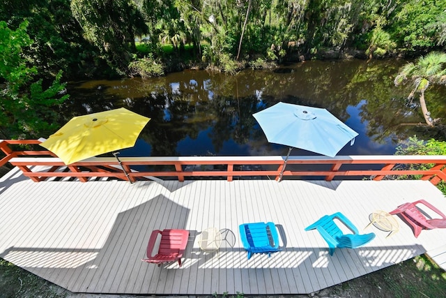 4617 John Moore Rd, Brandon, FL 33511 - dock with view of wooded area and a deck with water view