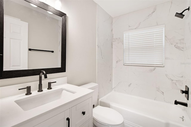 full bathroom with tiled shower / bath, vanity, and toilet