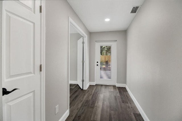 hallway with dark hardwood / wood-style flooring