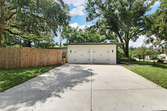 garage with a lawn