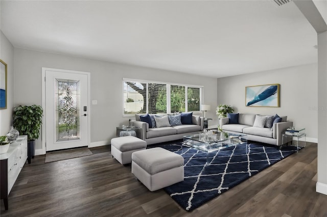 living room with baseboards and wood finished floors