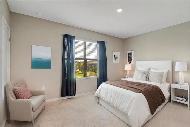 bedroom with recessed lighting, baseboards, and light colored carpet