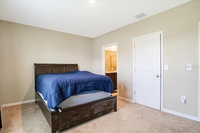 bedroom featuring baseboards, visible vents, and light colored carpet