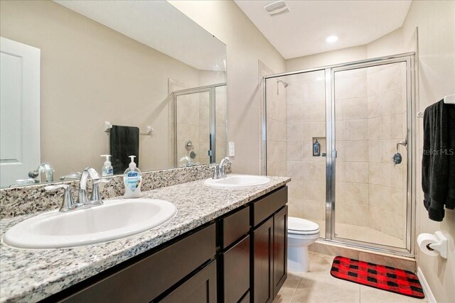 full bathroom featuring a stall shower, tile patterned flooring, a sink, and visible vents