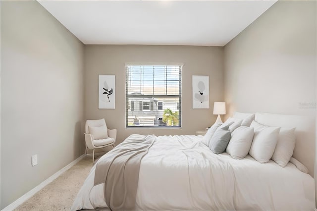 carpeted bedroom with baseboards