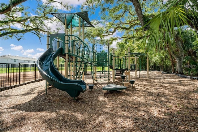 communal playground featuring fence