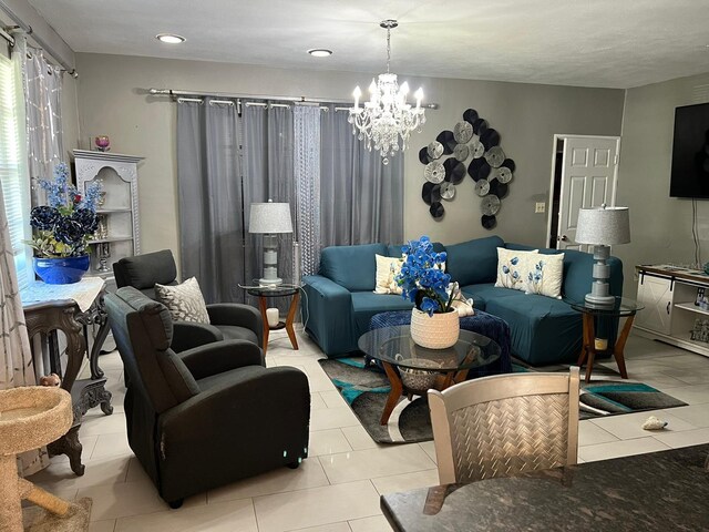 living room with a chandelier and light tile patterned flooring