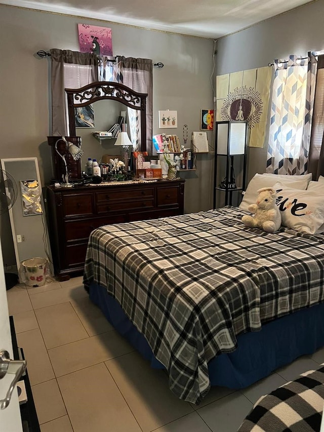 bedroom featuring light tile patterned floors