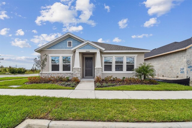 view of front of property with a front lawn