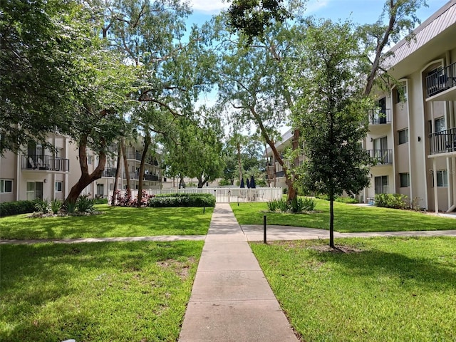 4606 W Gray St Unit 110, Tampa, FL 33609 - surrounding community with a lawn