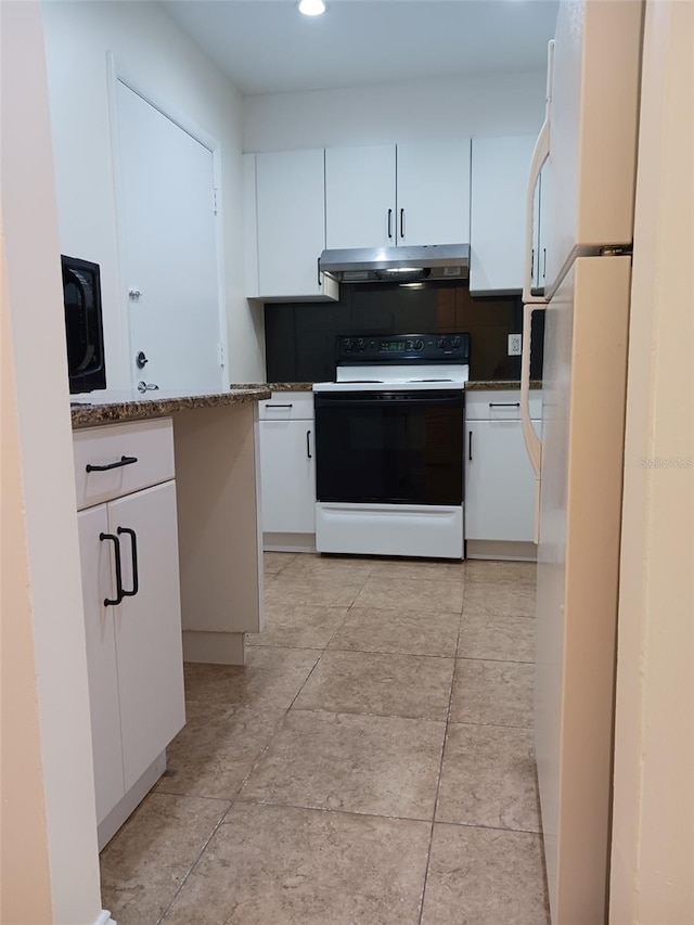 kitchen featuring stone countertops, white appliances, and white cabinets