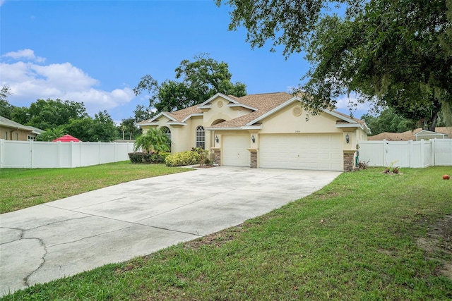 view of front of house with a garage and a front yard