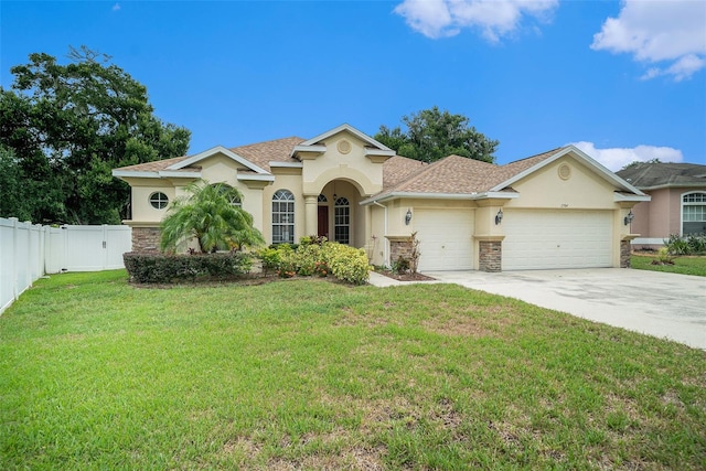 view of front facade featuring a front lawn and a garage