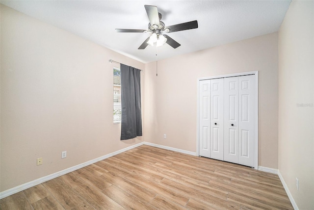 unfurnished bedroom with a closet, ceiling fan, and light hardwood / wood-style flooring