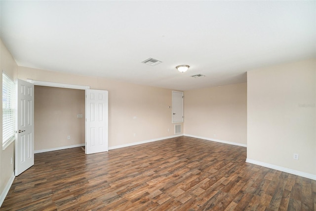 unfurnished bedroom featuring dark wood-type flooring