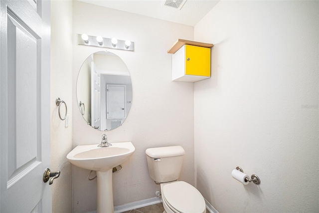 bathroom featuring toilet