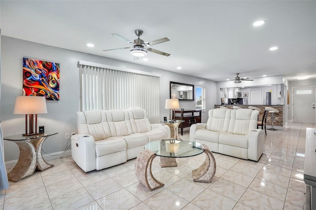 tiled living room with ceiling fan