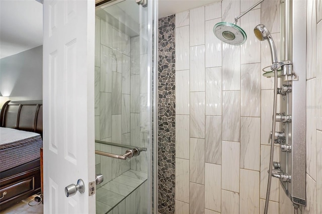 bathroom with a tile shower