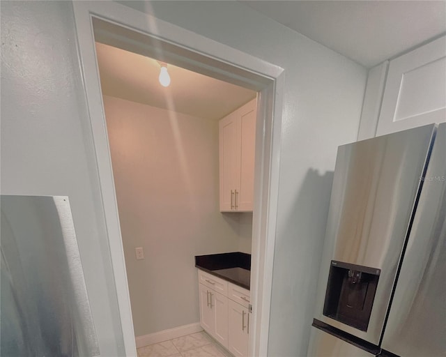 1819 Shore Dr S Unit 318, South Pasadena, FL 33707 - bathroom with marble look tile flooring and baseboards