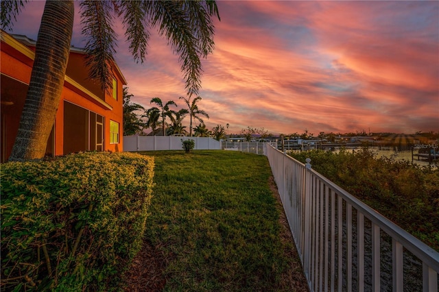 view of yard at dusk