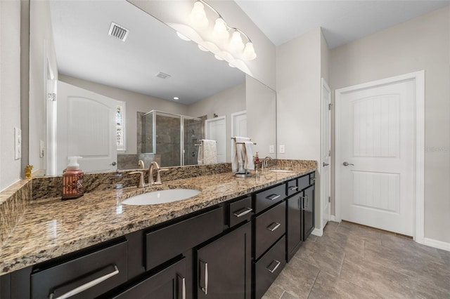 bathroom with vanity and an enclosed shower