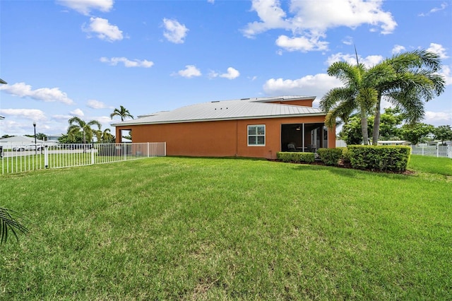 back of house featuring a yard