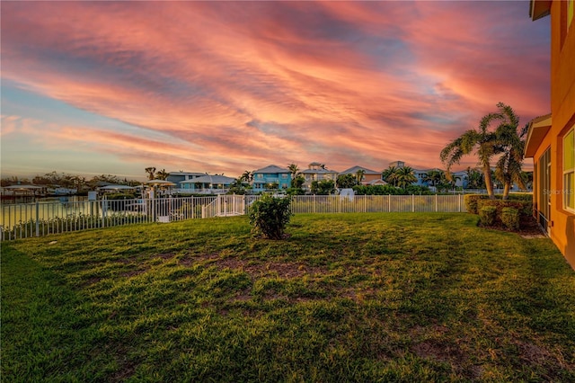 view of yard at dusk