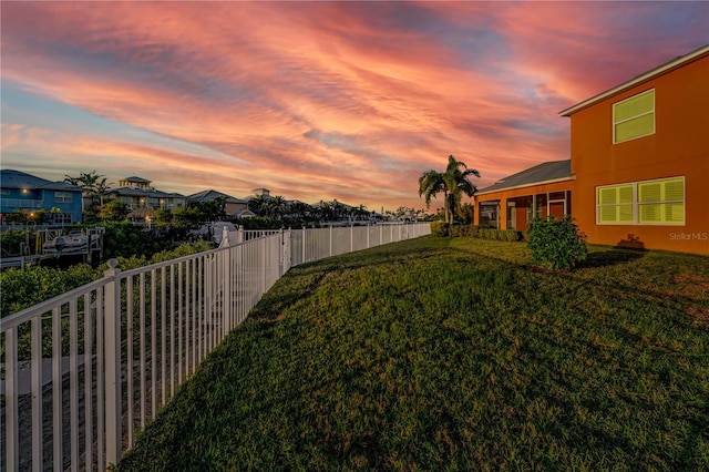 view of yard at dusk