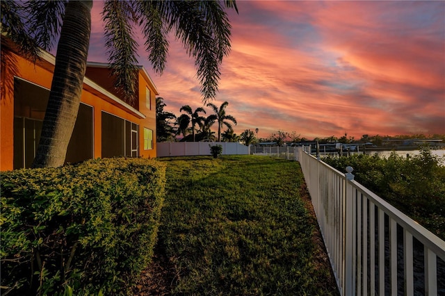 view of yard at dusk