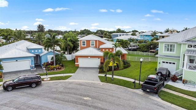 view of front of home with a garage and a front lawn